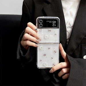 Close-up of clear folding case with 3D pearl hearts and silver butterflies for Z Flip