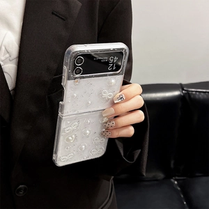 Detail of luxury transparent phone case with embedded pearls and glitter for Samsung Z Flip