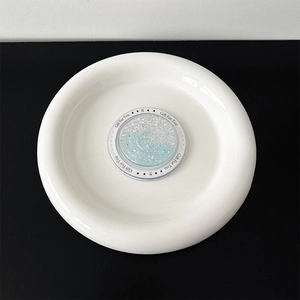 Detail of glittery blue heart phone socket with Gift For You print and magnetic base