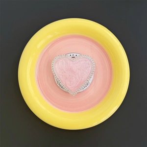 Close-up of pink heart magnetic phone socket with rhinestones and gift card