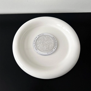 Detail of glitter-filled circular phone grip with Gift For You print and starry pattern