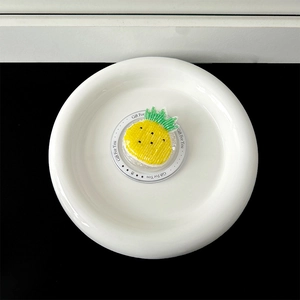 Close-up of handmade beaded pineapple brooch on a white Gift For You card display