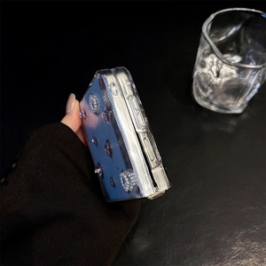 Detail view of light blue Galaxy Z Flip case with elegant pearl and metal ornaments