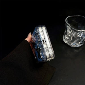 Detail of glitter silver foil phone case showing precision cutouts for foldable phones