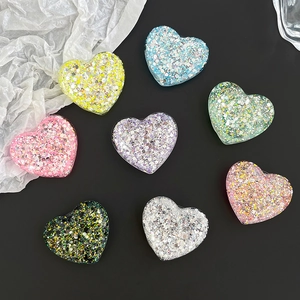 Sparkly glitter heart-shaped expanding phone grips in 8 vibrant colors with epoxy resin finish