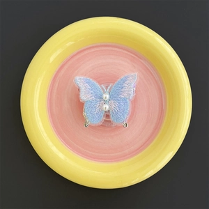 Detail of embroidered butterfly phone grip with white pearls and blue purple gradient silk