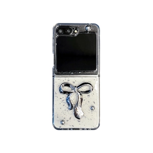 Silver foil glitter phone case for Samsung Galaxy Z Flip 6 with a 3D metallic ribbon bow