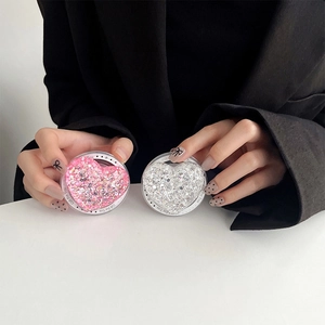 Detailed macro view of heart-shaped glitter phone sockets in pink and silver finish