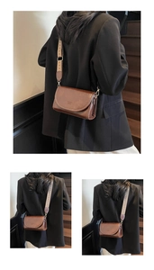 Detail of vintage brown crossbody bag featuring wide jacquard strap and fashion bags text