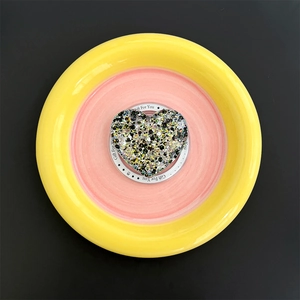 Detailed macro view of heart-shaped glitter phone socket with Gift For You decorative card