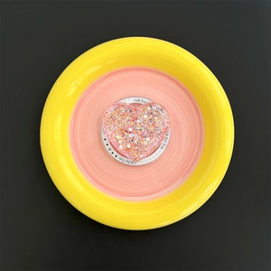 Macro view of heart-shaped glitter phone grip with colorful sequins and Gift For You label