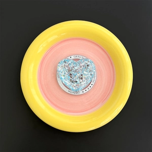 Close-up of a blue glitter heart phone grip with Gift For You text on the base