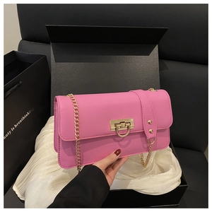 Pink chain shoulder bag with gold hardware detail and luxury gift box packaging