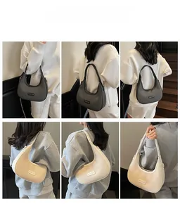 Detailed views of hobo crescent bags in grey and white with woven texture and chain strap