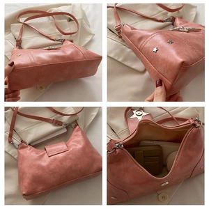 Detail of coral pink tote bag with star ornament, adjustable strap, and lychee texture