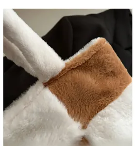 Detail of soft white and brown plush fabric texture on a large tote bag design