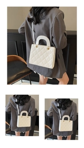 Macro view of white quilted faux leather texture and elegant diamond stitching detail
