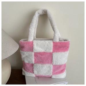 Detailed view of plush pink and white checkered tote bag on minimalist bookshelf