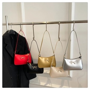 Detailed display of mini underarm bags in five colors with bow hardware