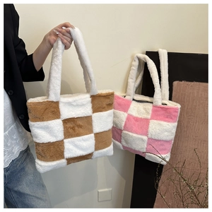 Close-up of plush checkerboard tote bags showing soft texture and cozy fur material