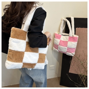 Detail of soft faux fur checkered tote bag with plush shoulder straps and large capacity