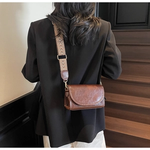 Brown vintage PU leather bag with colorful geometric jacquard wide shoulder strap detail