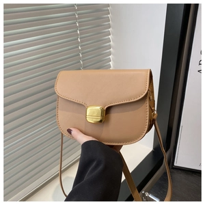 Close-up of matte khaki crossbody bag featuring a premium gold square metal buckle clasp