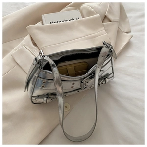 Internal view of silver metallic shoulder bag showing phone and wallet storage capacity