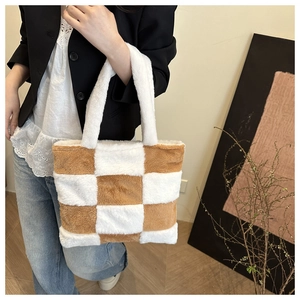 Brown and white checkerboard plush tote bag shown with casual lifestyle outfit