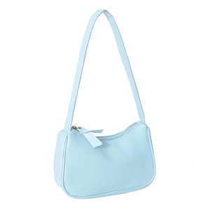 Mini light blue shoulder bag with minimalist leather design and zipper closure on white background
