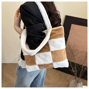 Detail of large plush checkerboard tote bag with brown and white faux fur texture