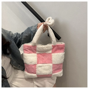 Detail of pink and white checkered plush tote bag with soft faux fur texture