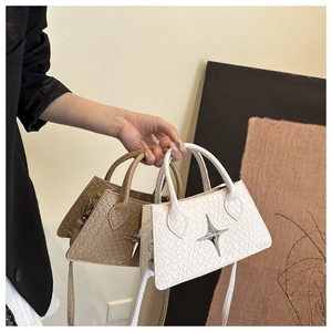 Detail of woven texture leather mini bags with silver star clasp and crossbody straps