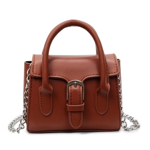Minimalist dark brown leather mini handbag with top handle and silver chain strap