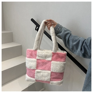 Detail of pink and white checkered plush tote bag featuring soft faux fur texture