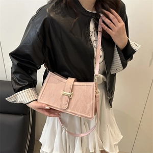 Pink baguette shoulder bag with crinkled patent finish and gold metal buckle detail