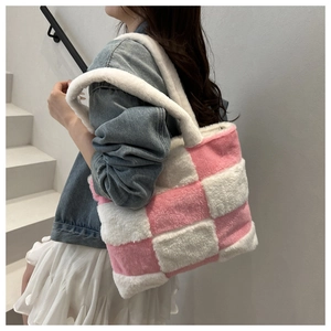 Close-up of pink and white checkered plush tote bag featuring soft faux fur texture