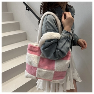 Detail of pink and white checkered plush tote bag with soft faux fur texture