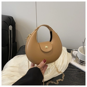 Detail of khaki crescent shoulder bag featuring premium matte PU leather and gold hardware