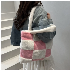 Detail of pink and white checkered plush tote bag with soft faux fur texture