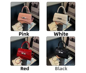 Detail view of crocodile texture handbags in pink, white, red, and black leather with metal locks
