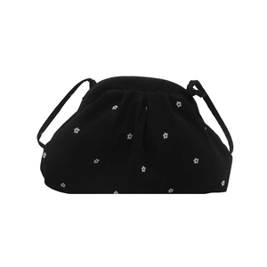 Floral print ruffled chiffon crossbody bag with white flower pattern on black fabric