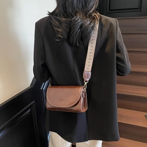Retro brown crossbody bag with woven wide strap and polished oil leather finish