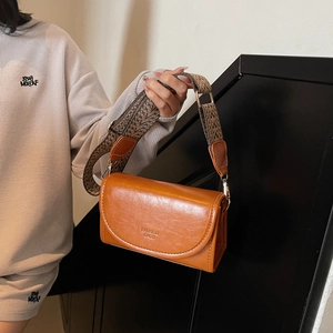 Retro brown leather square shoulder bag with patterned wide strap and flap closure
