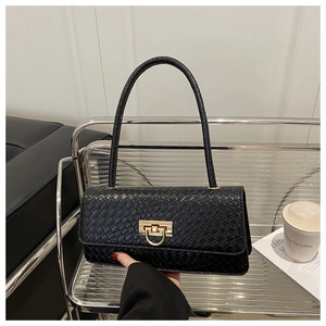 Close-up of black woven texture shoulder bag with premium gold twist lock detail