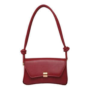 Red leather baguette shoulder bag with gold buckle and crescent moon shape design