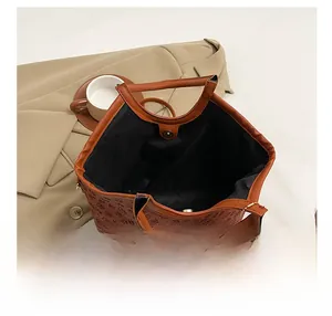 Top view of spacious brown floral tote bag showing large interior compartment