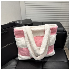 Close-up of soft pink and white striped faux fur texture on a large tote bag
