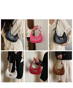 Detailed views of crossbody half-moon bags with bow charm in multiple colors