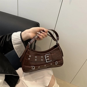 Minimalist dark brown patent leather shoulder bag with vintage silver metal eyelets